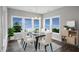 Elegant dining room with a glass table and ample natural light at 81 Eagle Crest Ct # Apex Craftsman, Lillington, NC 27546