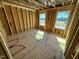 Unfinished bedroom with two windows and wood flooring at 81 Eagle Crest Ct # Apex Craftsman, Lillington, NC 27546