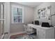 Home office with white desk and coastal-themed artwork at 81 Eagle Crest Ct # Apex Craftsman, Lillington, NC 27546