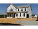 Two-story house with gray siding and a covered porch at 81 Eagle Crest Ct # Apex Craftsman, Lillington, NC 27546