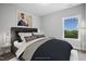 Bright bedroom with a comfortable bed, large window, and stylish decor at 81 Eagle Crest Ct # Apex Craftsman, Lillington, NC 27546