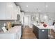 White kitchen cabinets and a large island highlight this open space at 81 Eagle Crest Ct # Apex Craftsman, Lillington, NC 27546