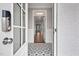 Modern entryway with patterned tile floor, keyless entry, and view to the living room at 81 Eagle Crest Ct # Apex Craftsman, Lillington, NC 27546