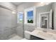 Well-lit bathroom featuring a shower and a vanity with white countertop at 81 Eagle Crest Ct # Apex Craftsman, Lillington, NC 27546