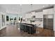 Spacious kitchen boasts an island, white cabinets, and stainless steel appliances at 81 Eagle Crest Ct # Apex Craftsman, Lillington, NC 27546