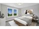Second bedroom with a full-size bed and two windows showing the backyard at 81 Eagle Crest Ct # Apex Craftsman, Lillington, NC 27546