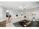 Spacious living room with sectional sofa and access to foyer at 81 Eagle Crest Ct # Apex Craftsman, Lillington, NC 27546