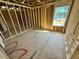 Unfinished bedroom with large window and wood flooring at 81 Eagle Crest Ct # Apex Craftsman, Lillington, NC 27546