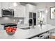 Modern kitchen with white cabinets, a large island, and a stylish sink and faucet at 81 Eagle Crest Ct # Apex Craftsman, Lillington, NC 27546