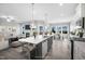 Open concept kitchen with island, dining area, and living room views at 81 Eagle Crest Ct # Apex Craftsman, Lillington, NC 27546