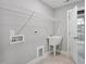 Convenient laundry room with utility sink and ample shelving at 81 Eagle Crest Ct # Apex Craftsman, Lillington, NC 27546