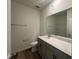 Clean bathroom featuring gray vanity, white toilet and bathtub at 150 Chestnut Oak Ln, Lillington, NC 27546