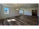 Bright dining room features hardwood floors and a modern light fixture at 150 Chestnut Oak Ln, Lillington, NC 27546