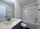 Clean bathroom featuring a bathtub, sink, and toilet at 175 W Saltgrass Ln, Smithfield, NC 27577