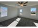 Spacious bedroom with gray carpeting and multiple windows at 175 W Saltgrass Ln, Smithfield, NC 27577