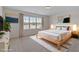 Bedroom with a queen bed and lots of natural light at 6418 Swatner Dr, Raleigh, NC 27612