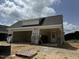 Newly constructed home with attached garage and covered porch at 353 Village Walk Dr, Clayton, NC 27527