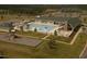 Aerial view of community pool, clubhouse, and playground at 13 Blackhorn Ct, Pittsboro, NC 27312