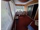 Sunroom with rocking chair and sliding glass doors at 1917 New Hill Olive Chapel Rd, New Hill, NC 27562