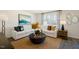 Spacious living room with sectional sofa, coffee table, and large window at 410 Leven Dr, Gibsonville, NC 27249