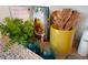 Kitchen counter with cookbook, utensils, and small plants at 410 Leven Dr, Gibsonville, NC 27249