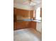 Bright kitchen with ample wood cabinets and a large window at 1525 Marshburn Rd, Wendell, NC 27591
