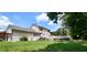 House's rear view, showcasing a deck, and partially visible garage at 1525 Marshburn Rd, Wendell, NC 27591