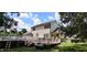 Elevated deck with a swimming pool, propane tank, and surrounding greenery at 1525 Marshburn Rd, Wendell, NC 27591