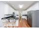 Eat-in kitchen with island, stainless steel appliances, and hardwood floors at 8246 Us-401, Fuquay Varina, NC 27526