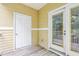 Small patio with exterior storage and French doors at 333 Glenolden Ct, Cary, NC 27513