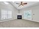 Bright living room featuring a fireplace and access to a balcony at 333 Glenolden Ct, Cary, NC 27513