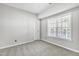 Bright bedroom with carpet and large window at 333 Glenolden Ct, Cary, NC 27513