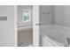 Bedroom with carpet and view into bathroom at 333 Glenolden Ct, Cary, NC 27513