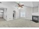 Living room with vaulted ceiling, fireplace and kitchen view at 333 Glenolden Ct, Cary, NC 27513