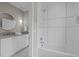 Clean bathroom with white subway tile, shower, and a bathtub at 2646 Marchmont St, Raleigh, NC 27608
