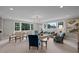 Spacious bonus room with seating area & game table, offering versatility for various uses at 2646 Marchmont St, Raleigh, NC 27608