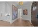 Bright entryway with herringbone floors and large artwork at 2646 Marchmont St, Raleigh, NC 27608