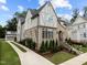 Brick and shingle two-story home with landscaping and driveway at 2646 Marchmont St, Raleigh, NC 27608