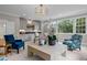 Relaxing game room with comfortable seating, wet bar, and large windows at 2646 Marchmont St, Raleigh, NC 27608