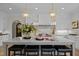 Eat-in kitchen with large island, seating, and high-end finishes at 2646 Marchmont St, Raleigh, NC 27608