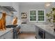 Spacious kitchen featuring a large island, stainless steel appliances, and white cabinetry at 2646 Marchmont St, Raleigh, NC 27608
