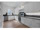 Butler's pantry with dark countertops, white cabinets, and built-in wine cooler at 2646 Marchmont St, Raleigh, NC 27608