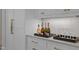 Butler's pantry with ample storage, quartz countertops, and wine refrigerator at 2646 Marchmont St, Raleigh, NC 27608