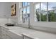 Modern farmhouse kitchen sink with a sleek faucet and marble countertops at 2646 Marchmont St, Raleigh, NC 27608