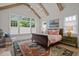 Spacious bedroom with high ceilings, exposed beams, and a large bed at 2646 Marchmont St, Raleigh, NC 27608