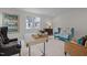 Home office with built-in desk, seating area, and large artwork at 2646 Marchmont St, Raleigh, NC 27608
