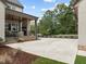 Large concrete patio with covered porch and built-in fireplace at 2646 Marchmont St, Raleigh, NC 27608