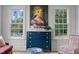 Sunroom with large windows and blue chest of drawers at 2646 Marchmont St, Raleigh, NC 27608
