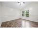 Bright bedroom with hardwood floors and two windows at 500 Dandelion Ct, Raleigh, NC 27610