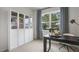 Home office with built-in shelving and large window at 752 Dorset Stream Dr, Fuquay Varina, NC 27526